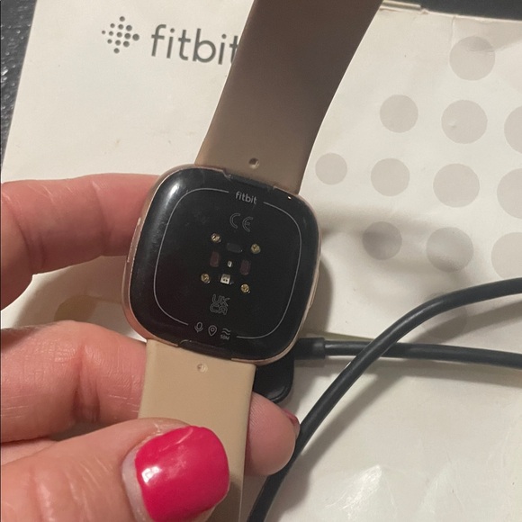 Fitbit Versa 4  with Pink Display and Tan Band - Picture 2 of 3